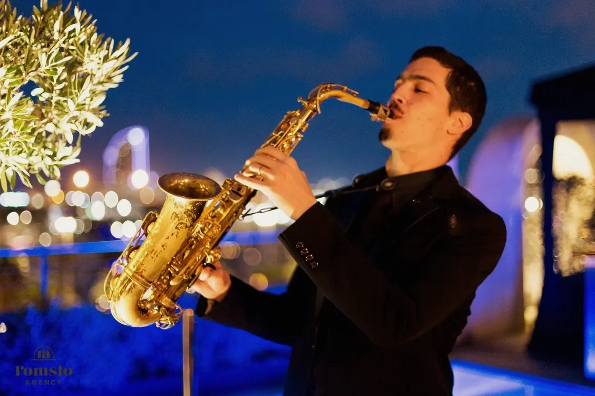 Man playing saxophone at an elegant New Year's Eve celebration