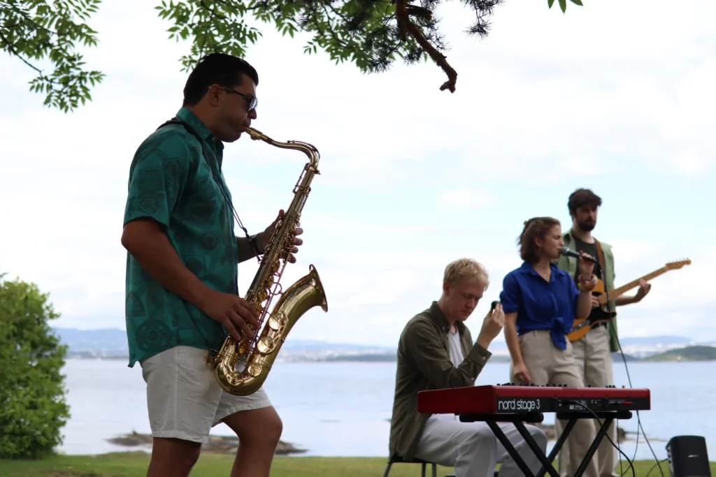 Live band entertaining guests at a private waterfront event, creating a lively atmosphere with music.