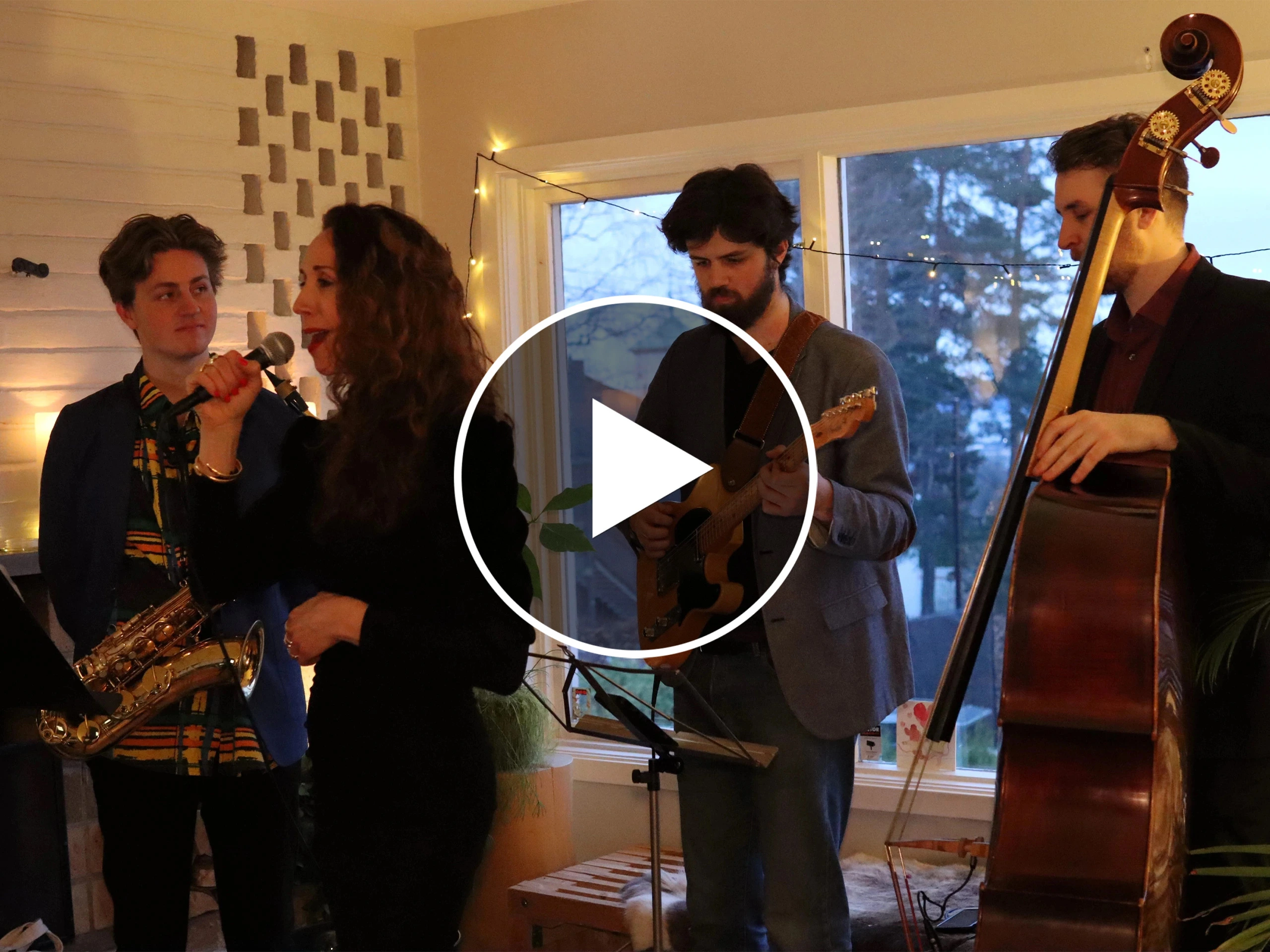 A band peforming french twist at a dimmed room for a Romslo Entertainment event.