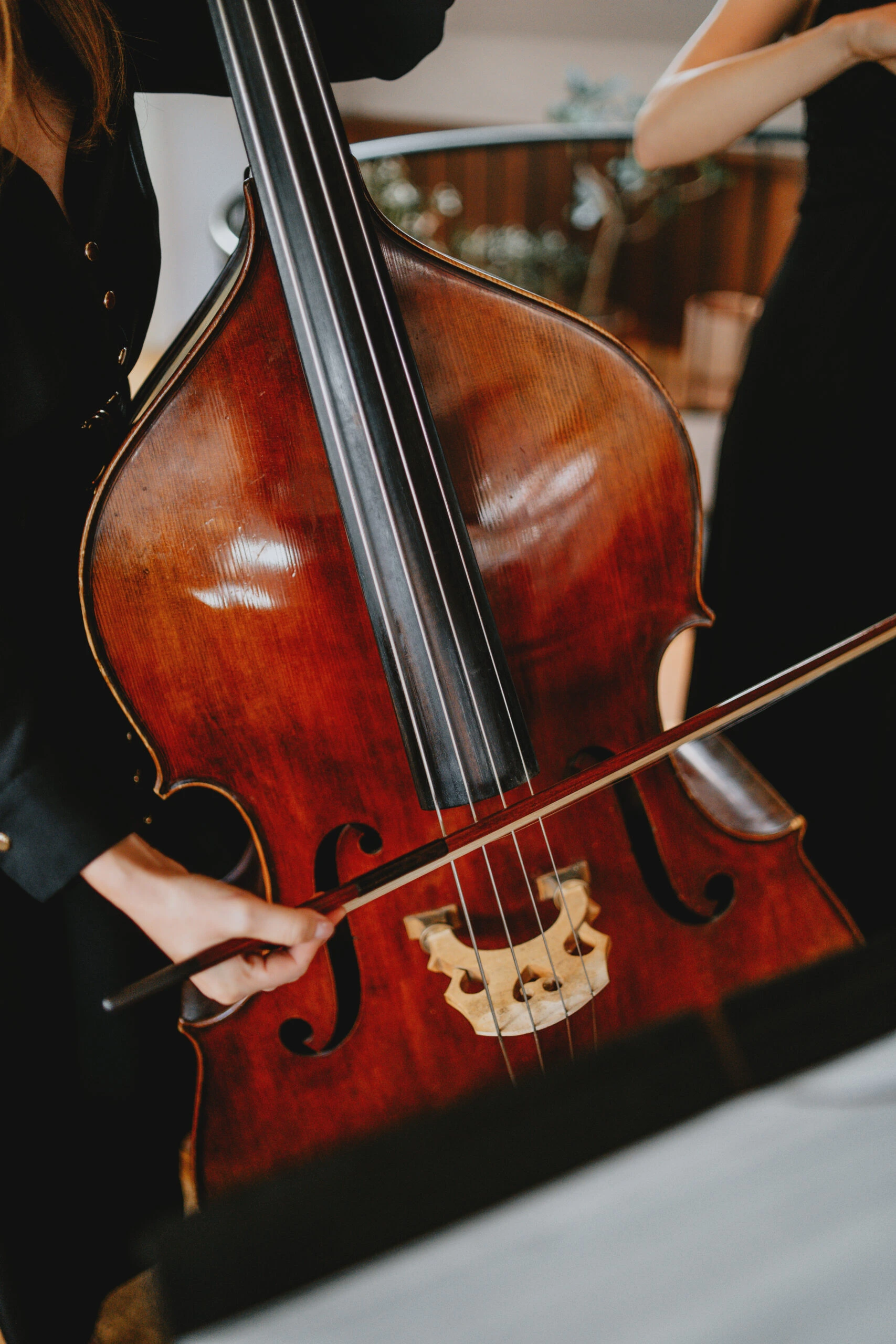 A cello placed elegantly at a memorial service setting.