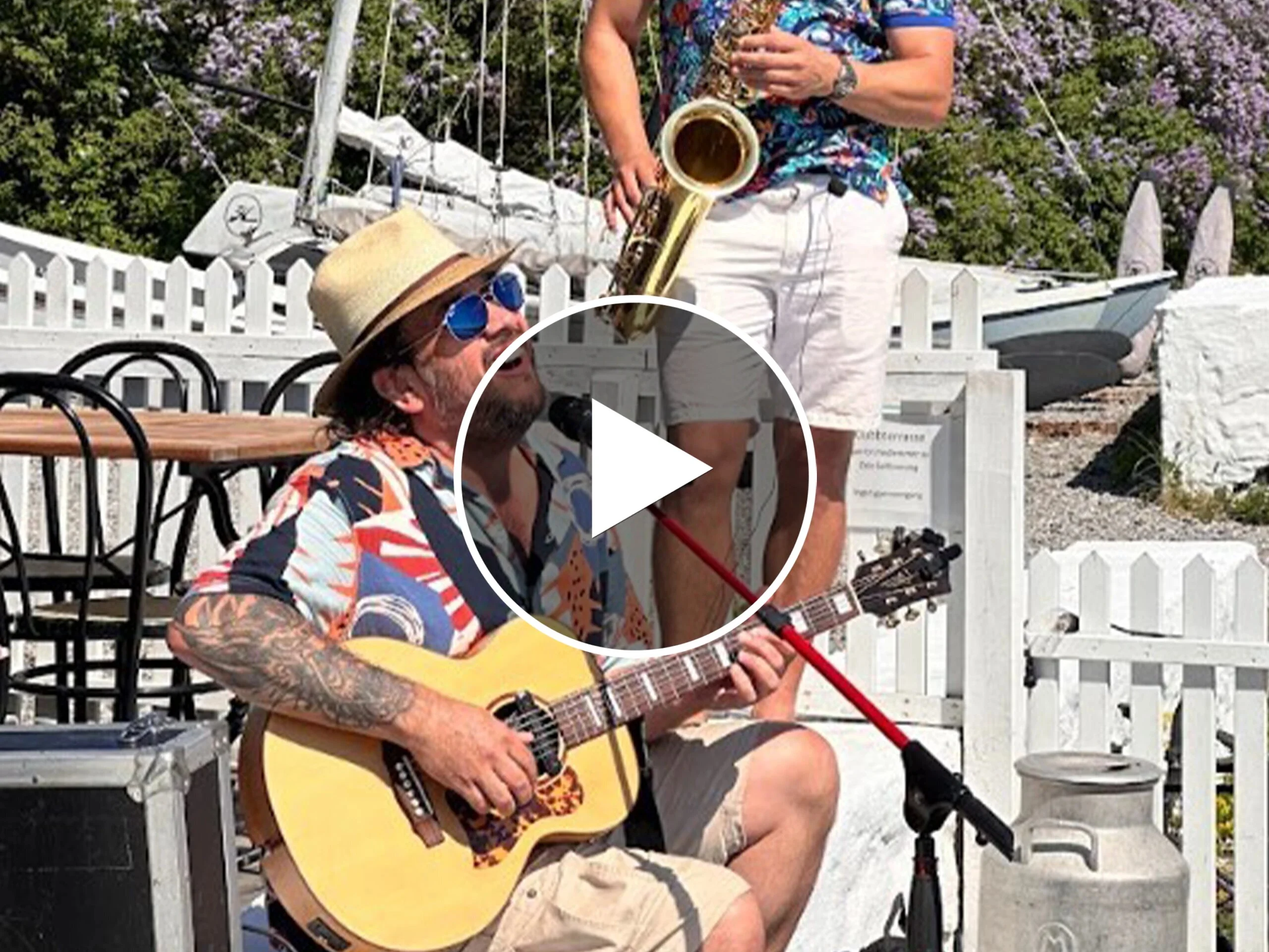 A man playing guitar with Latin rhythms as part of Romslo Entertainment in Norway.