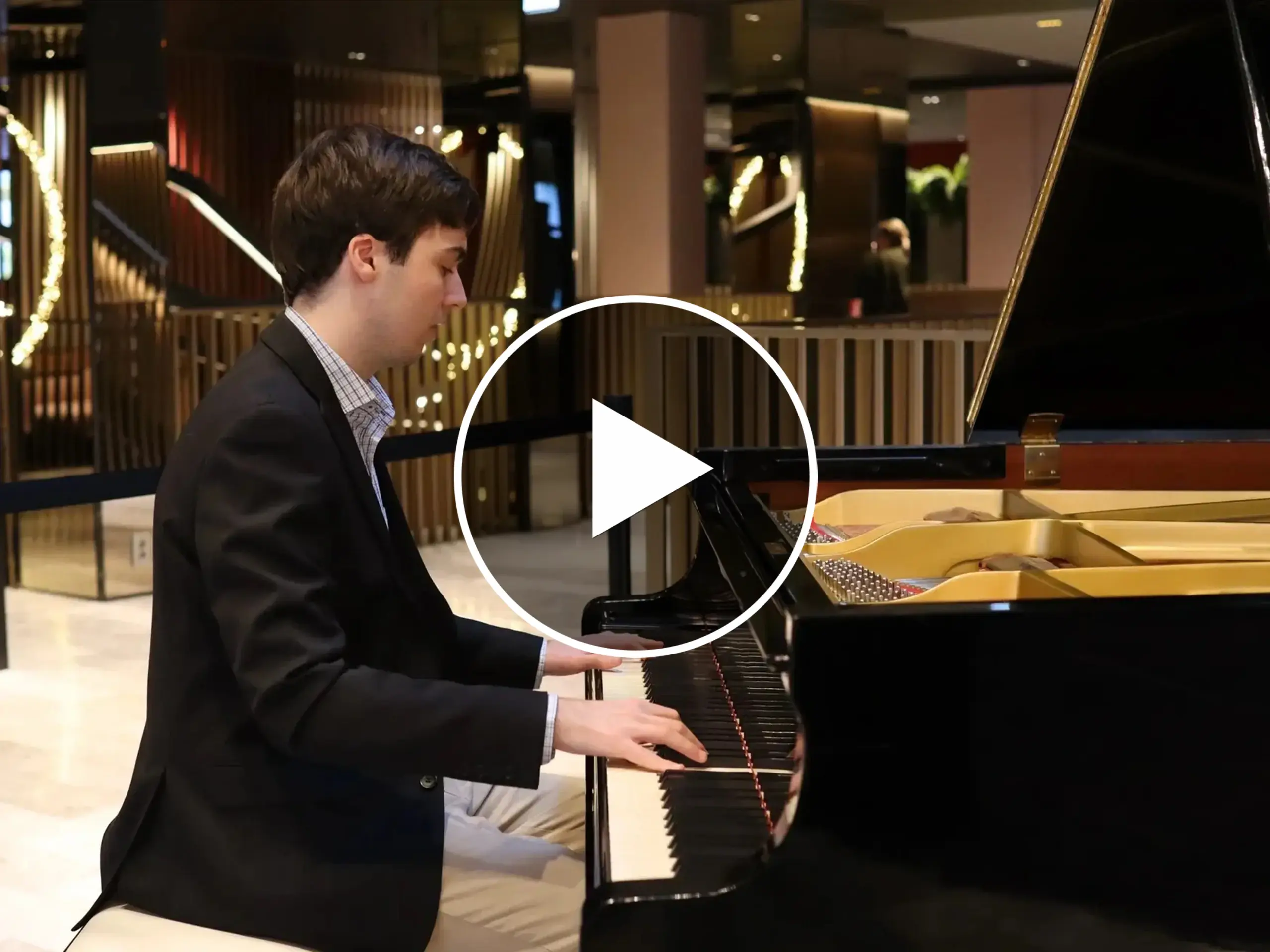 A man playing the piano as part of Romslo Entertainment in Norway.