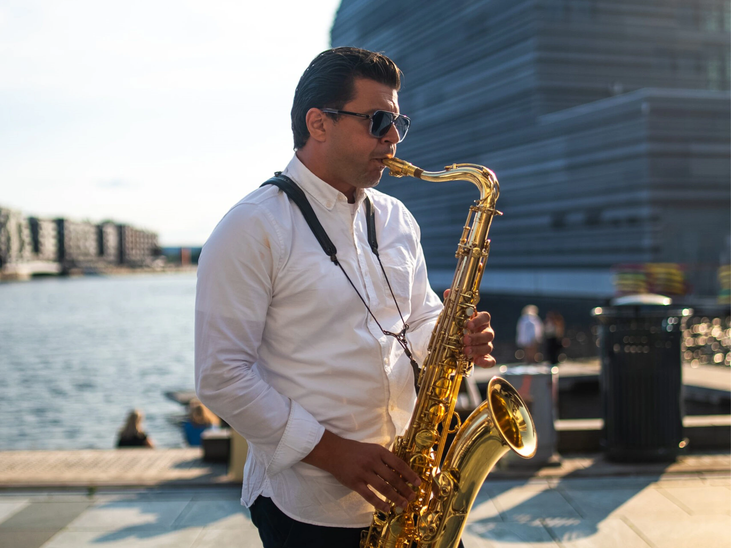 A man playing the saxophone as part of Romslo Entertainment in Norway.