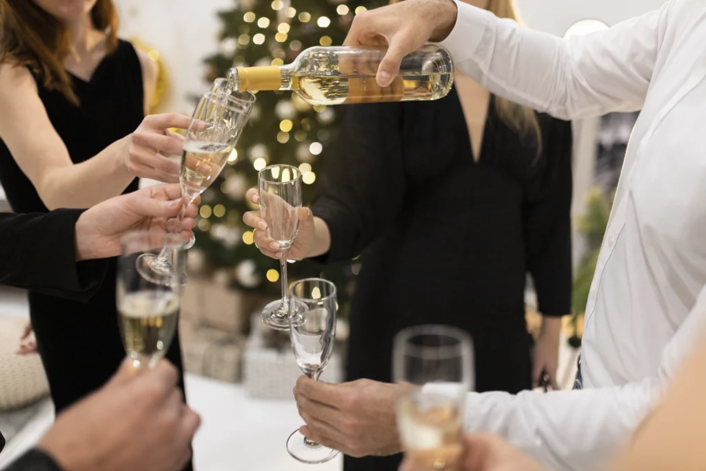 Employees celebrating the New Year at a corporate event with a festive toast.