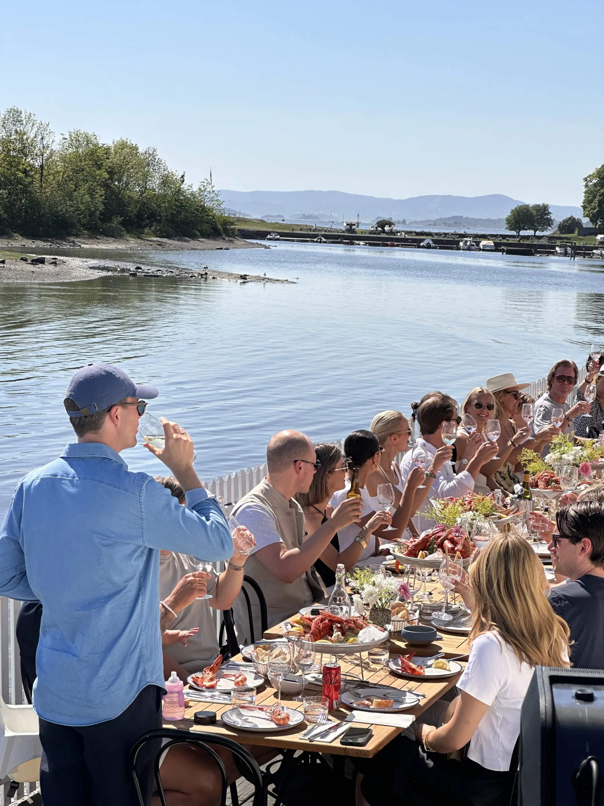 A private celebration by a scenic lake with a calm atmosphere.