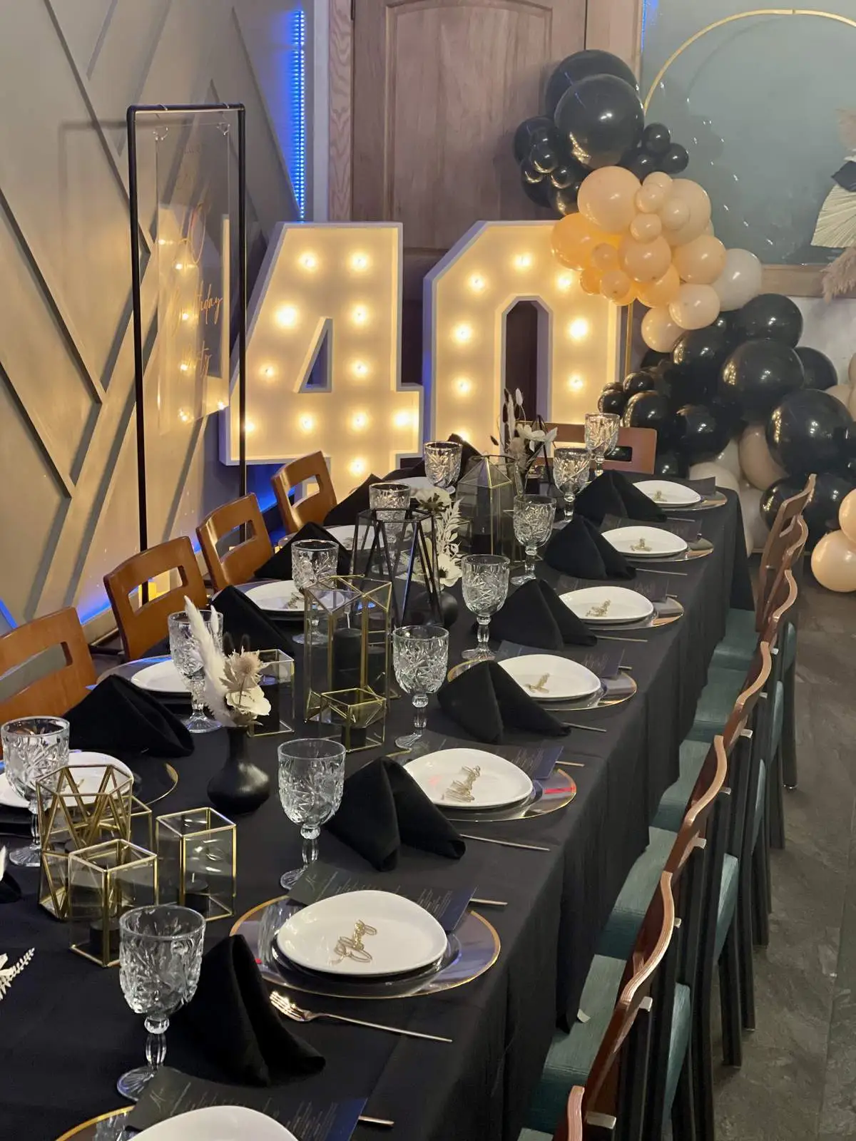 A beautifully arranged table setup for a birthday party celebration.