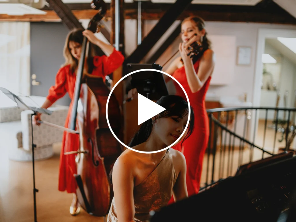 A band of three girls performing at a Christmas party, creating an elegant atmosphere.